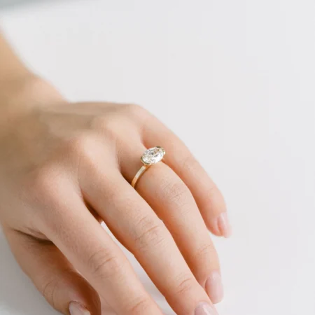 East West Oval Moissanite Half Bezel Ring