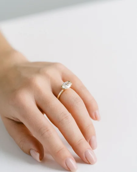East West Oval Moissanite Half Bezel Ring
