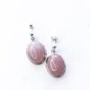a pair of sterling silver earrings with rose quartz stones