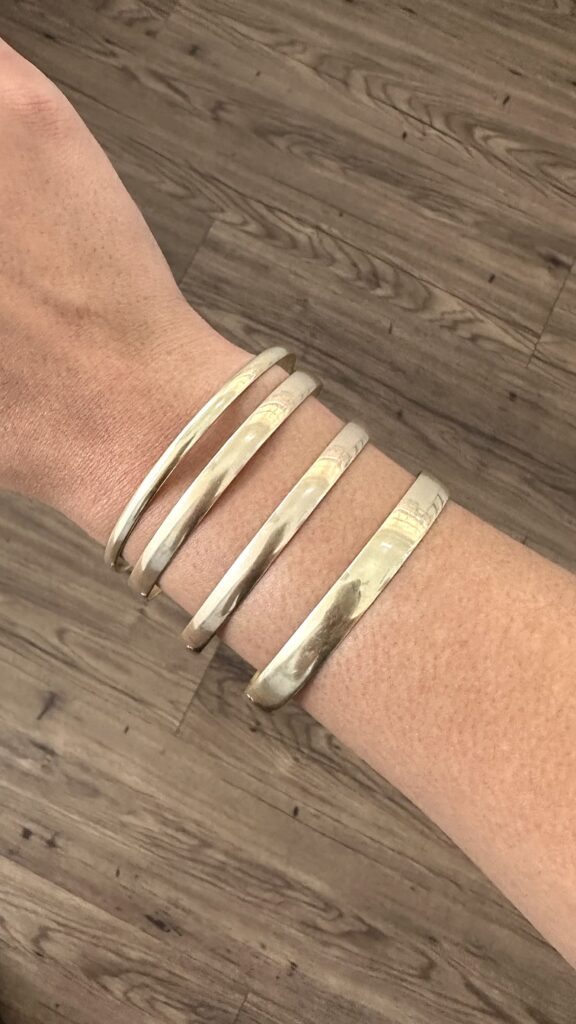 If you are looking for 9ct gold bangles in Cape Town, Aria Jewellery offers a refined collection crafted for lasting quality and timeless appeal. Our bangles are made from genuine 9ct gold and designed with clean finishes that suit both classic and modern jewellery preferences. Whether you are buying for yourself or selecting a meaningful gift, our gold bangles provide a considered balance of beauty, value, and craftsmanship. WHY CHOOSE 9CT GOLD BANGLES 9ct gold is a popular choice for bangles because it offers durability without compromising on authenticity. Crafted from a blend of pure gold and strengthening alloys, 9ct gold maintains its structure well and resists bending over time. This makes it especially suitable for bangles, where shape, balance, and long-term wear matter. You get real gold jewellery that holds its finish and remains reliable for years. OUR 9CT GOLD BANGLE COLLECTION Our 9ct gold bangle collection features a range of polished and minimal styles designed to suit different tastes. Each bangle is created with attention to proportion, ensuring it sits comfortably on the wrist while maintaining a refined appearance. These designs work well worn alone or styled alongside other gold jewellery pieces. Whether your preference is understated or more structured, our collection offers versatile options that remain timeless.